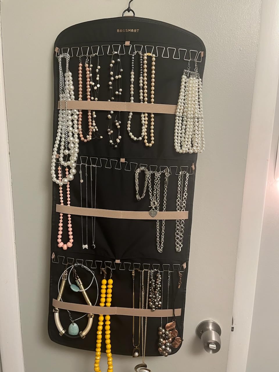 BAGSMART Hanging Jewelry Organizer, Necklace Holder Anti-tangle Earrings Rings Hanger with 20 Jewelry Bags Travel Storage Roll with Pockets Hang on Closet, Wall, Door, Large, Black customer photo 1