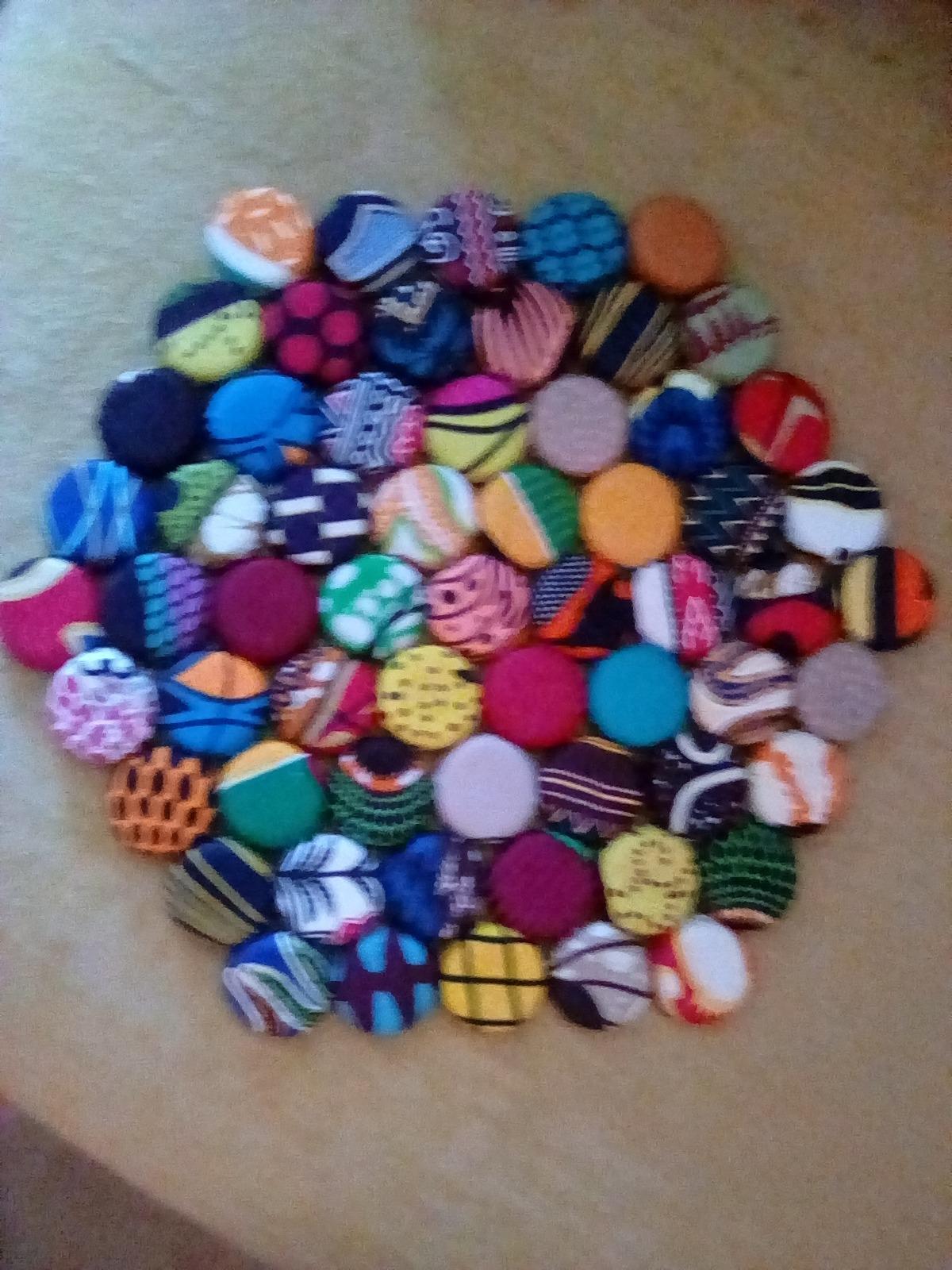 TEMBO AFRICA Handcrafted Trivet made of recycled bottle caps 10 Inches large Multicolored Handmade From Africa customer photo 1