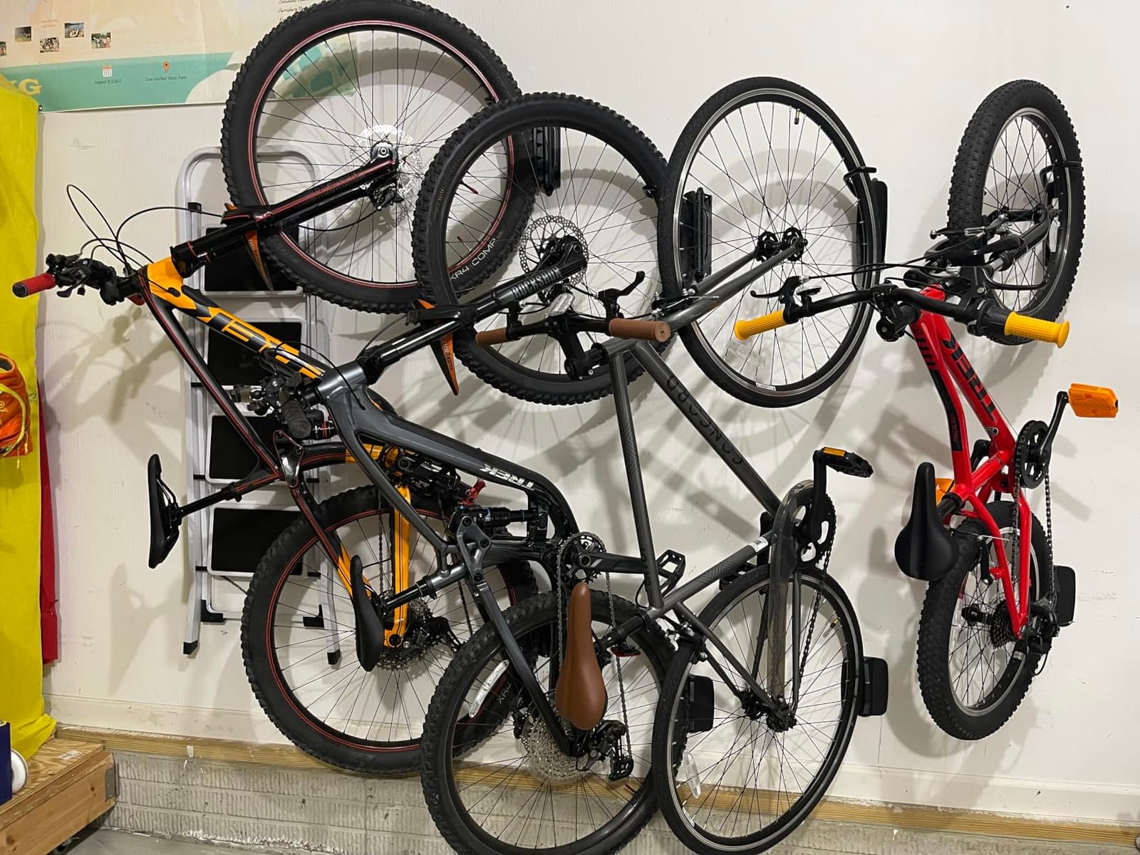 monTEK Swivel Bike Wall Mount, Bike Hangers for Garage, 4 Pack | Heavy-duty vertical wall bike storage rack swivels 150° to save space; holds 66 lb each and fits tires up to 3.54 in wide customer photo 1